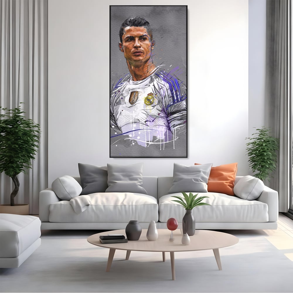 Tablou canvas cu tablou canvas cu cristiano ronaldo in tricoul real madrid, in rama de aluminiu negru, pe perete intr-un living